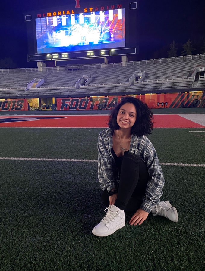 Girl sitting on the Illini Field