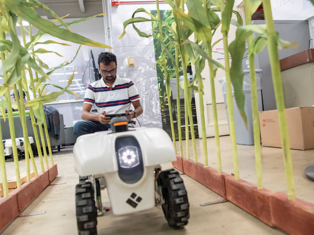 Student controlling a crops robot.