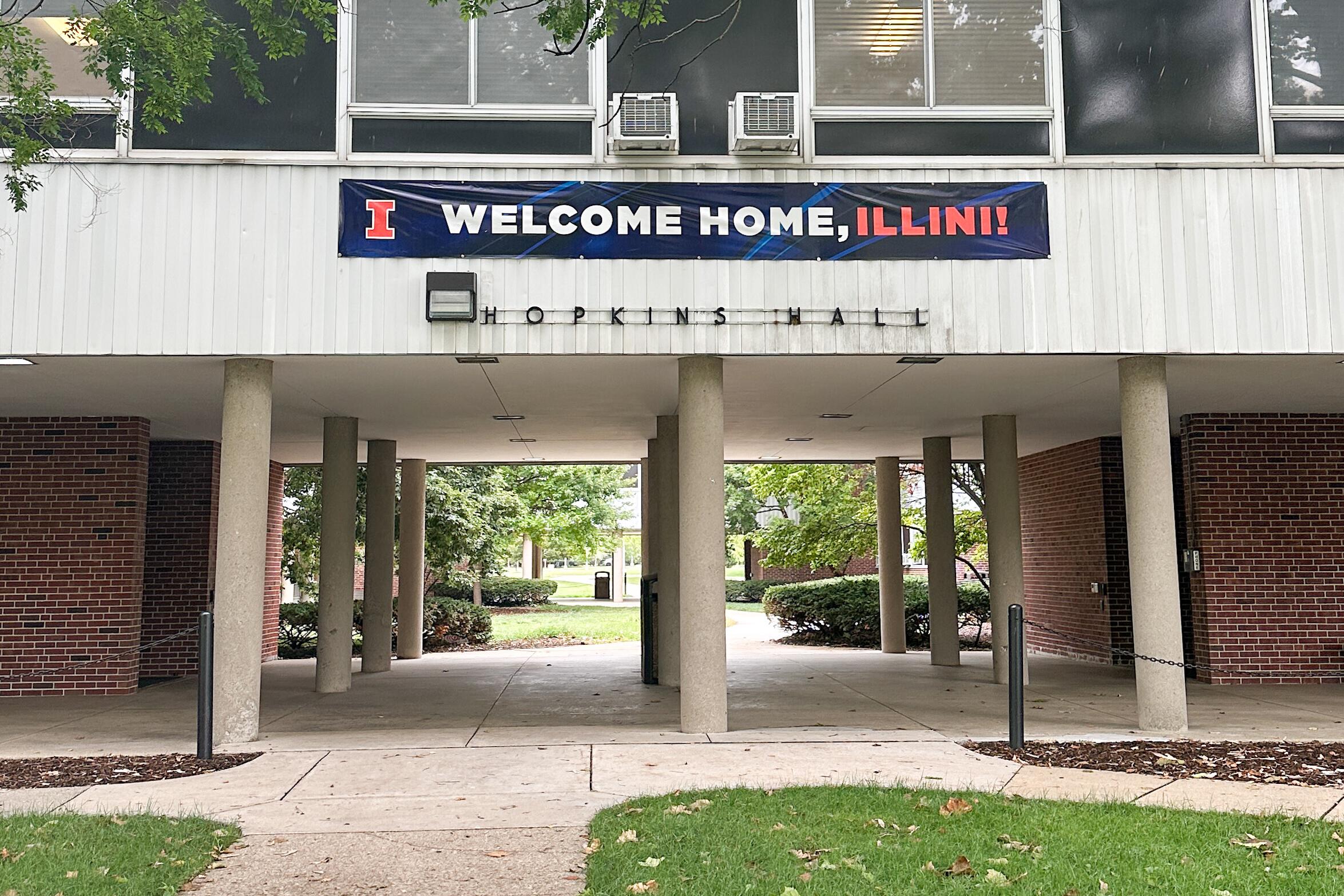 Welcome sign on campus dorm building