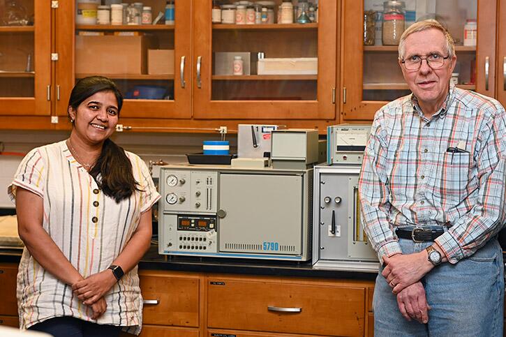 Jesmin (left) and Mulvaney (right) standing in a laboratory