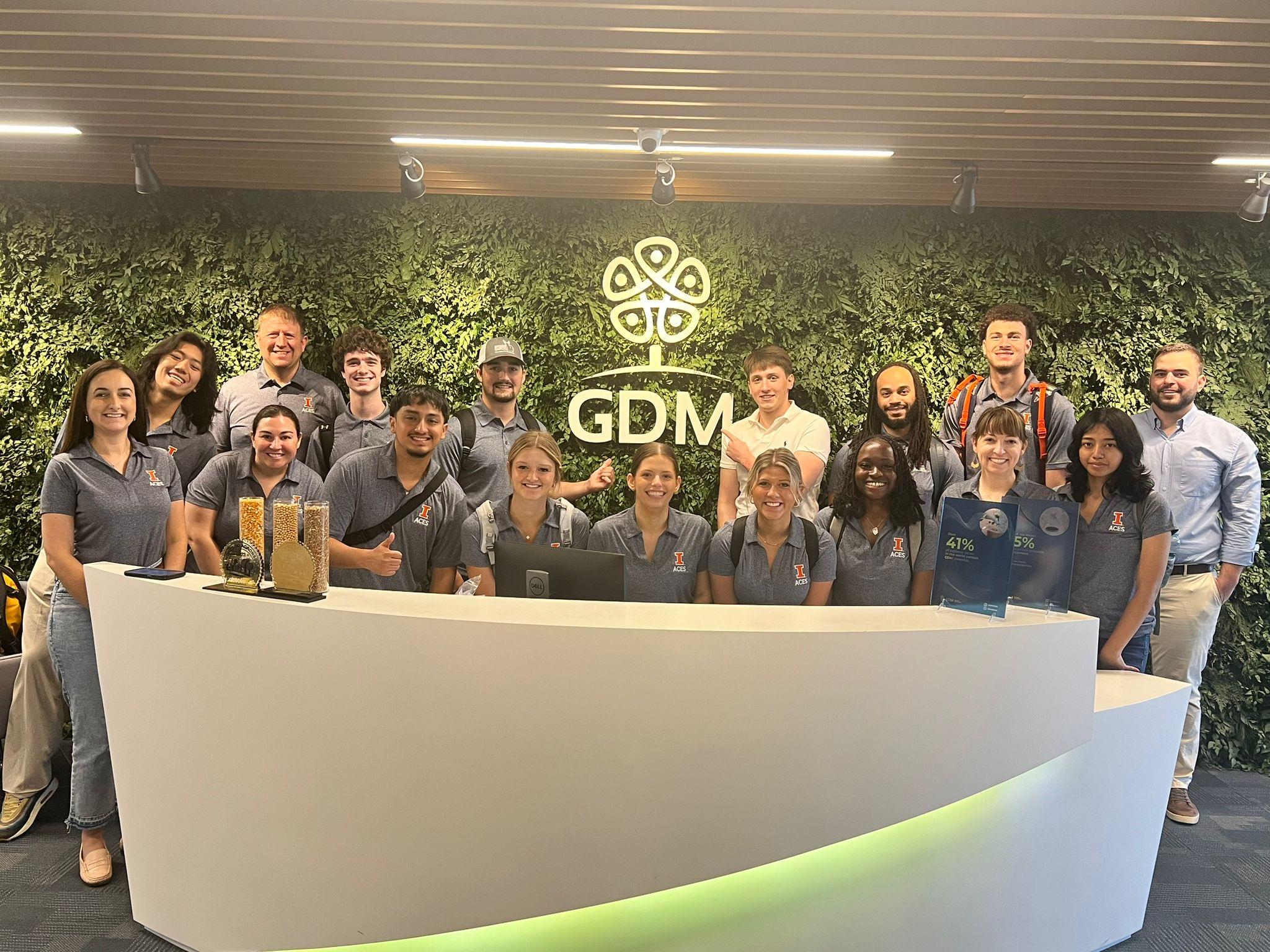 Group of students in front of a GDM sign