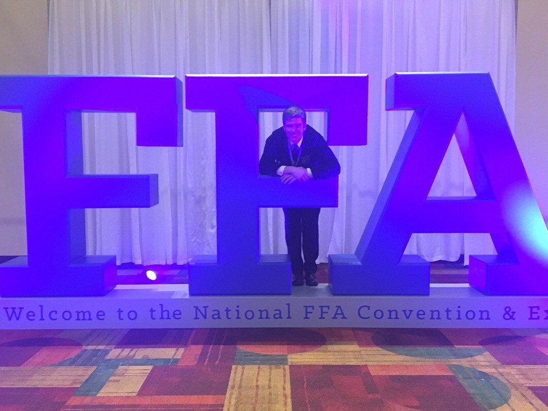 student with large FFA letters 