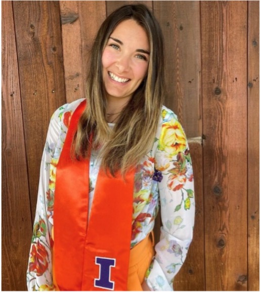 Woman with U of I graduation sash