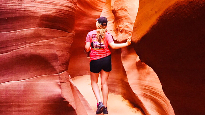 Maggie Sweppy walking through rock formations