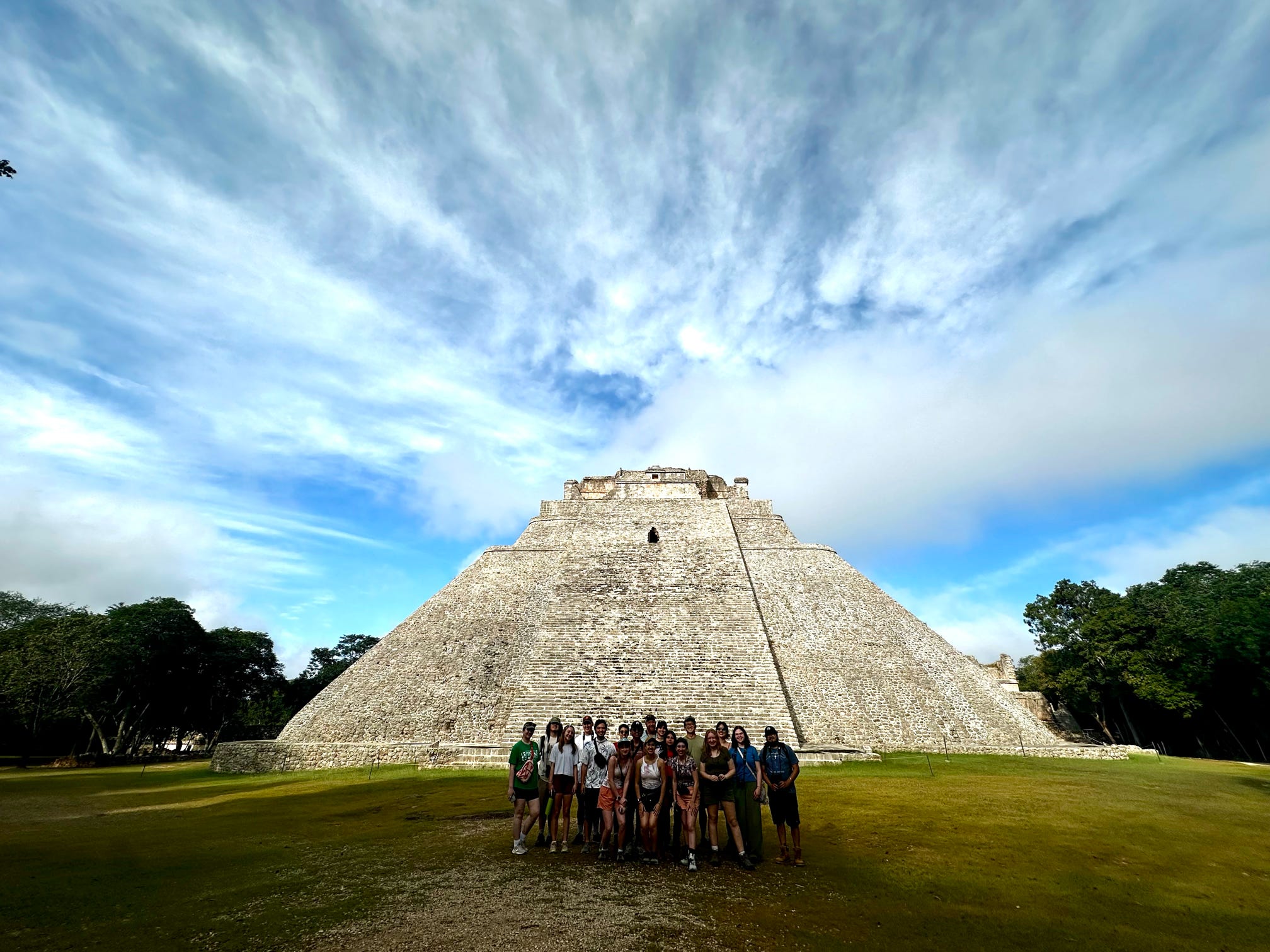 Students at the base of a Mayan temple in Mexico