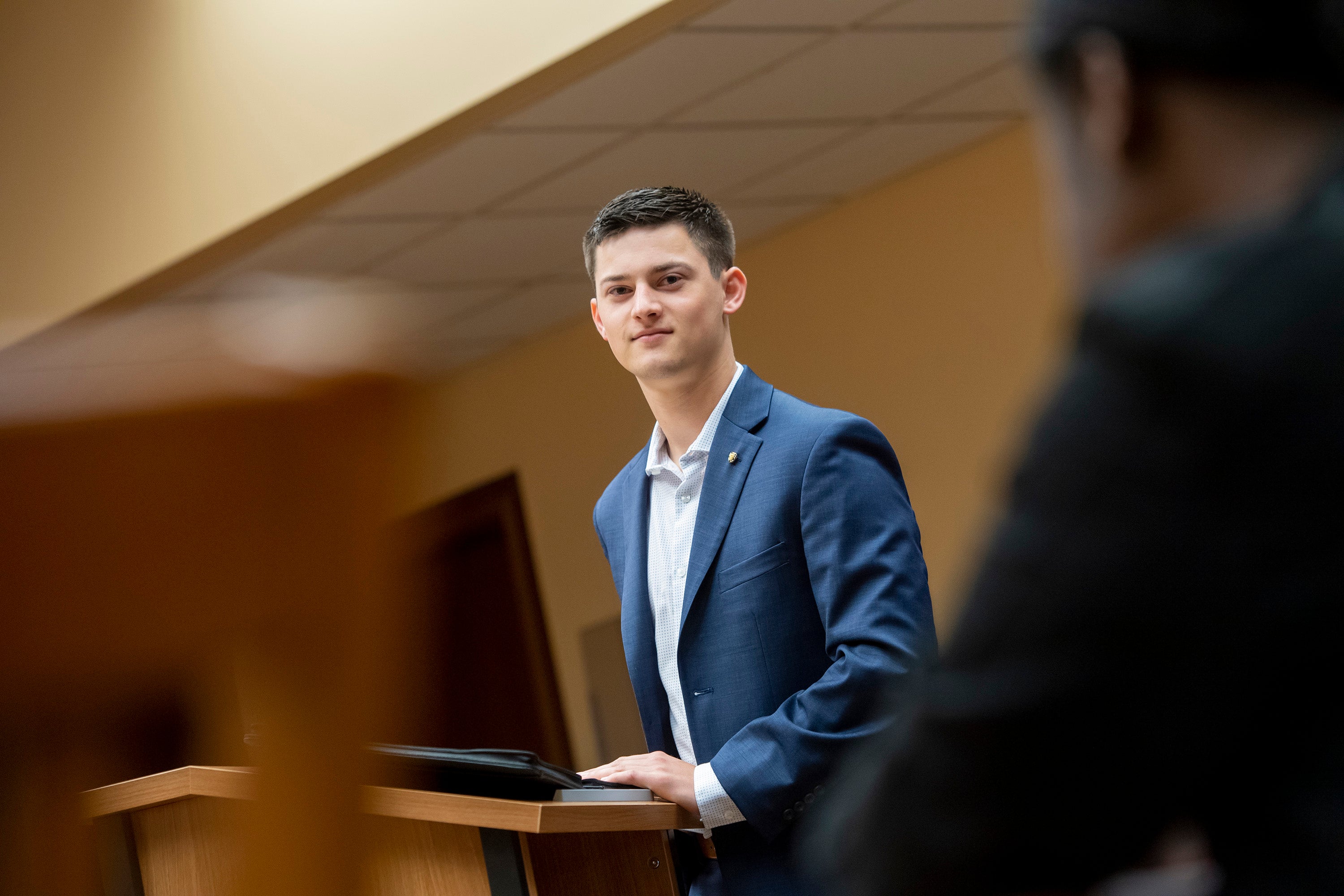 Student in a classroom looking at the camera