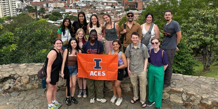 Group of ACES students on a hill in Colombia