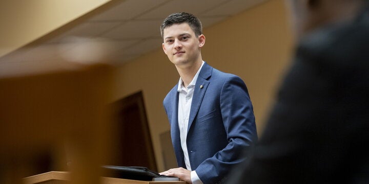 Student standing in classroom