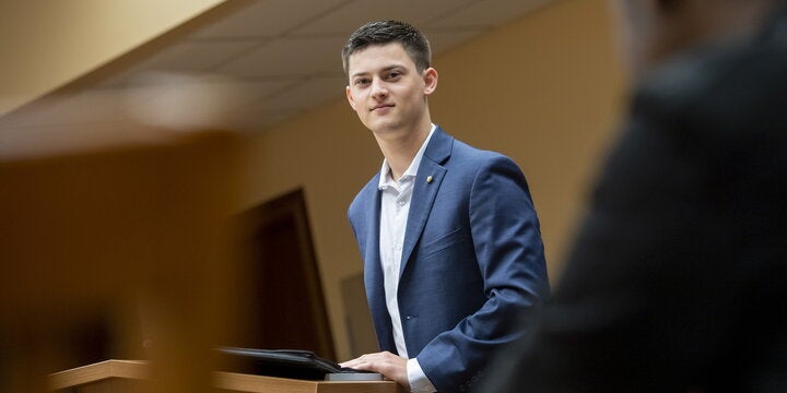 Student standing in classroom