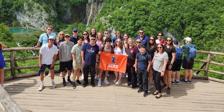 Group of ACES students in front of a waterfall in Croatia