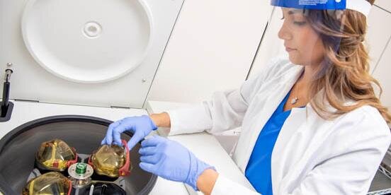 Student using equipment in a lab