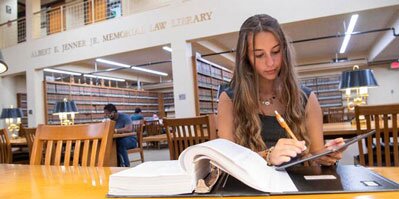 Student studying in the law library