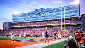 Illinois footballers on field. 