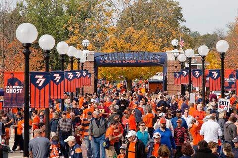 People tailgating outside Memorial Stadium.