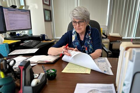 Kay Whitlock works in her office.