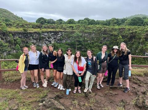 Students awarded Swanson scholarship take picture in front of greenery on the Galapagos Islands