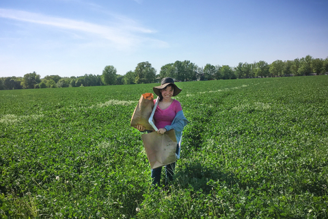 Young woman standing in a field of cover crops