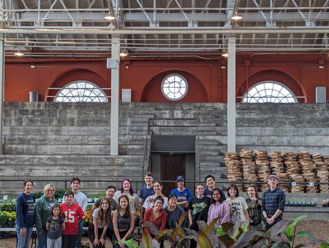 Spring Plant Fair team stands in the Stock Pavilion