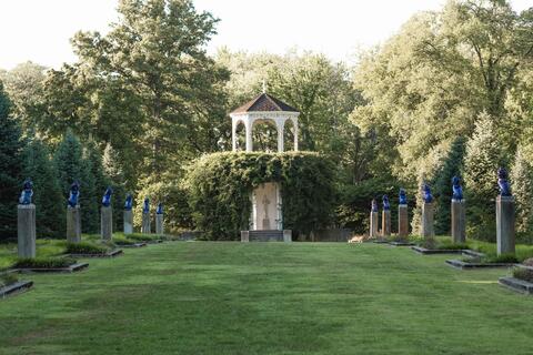 Stone statues line an Allerton garden.