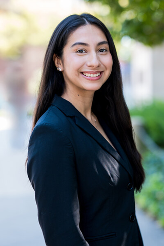 Ashley Equíhua smiles for headshot photo