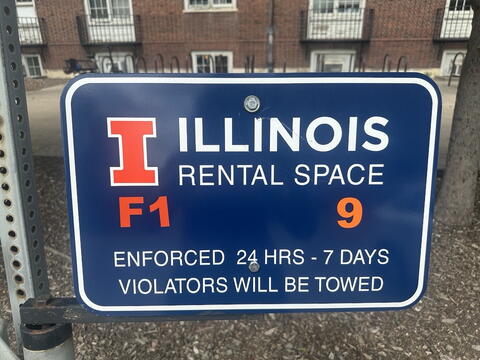 Parking space signage that indicates this is a reserved parking space and is not for visitor parking