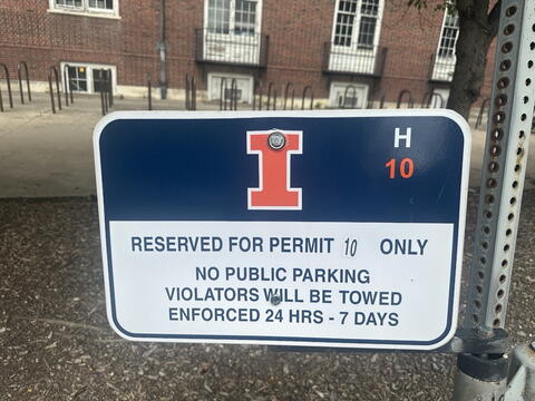 Parking space signage that indicates this is a reserved parking space and is not for visitor parking