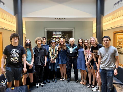 Grandin stands with a group of INI students.