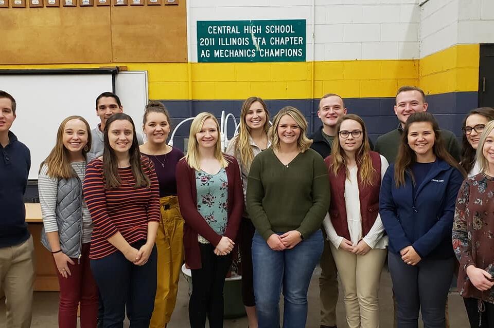 Group of Ag Ed Club students visiting with alum, Harley Carlson at Breese Central High School