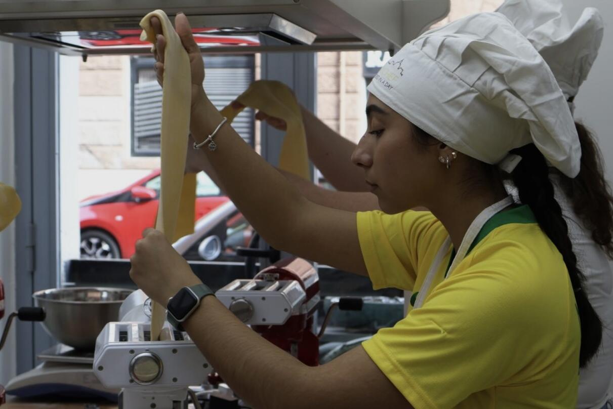 Ashley participating in a cooking class