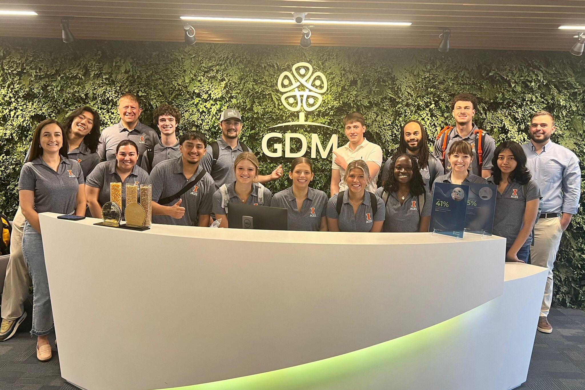 Group of students in front of a GDM sign