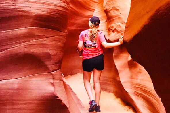 Maggie Sweppy walking through rock formations