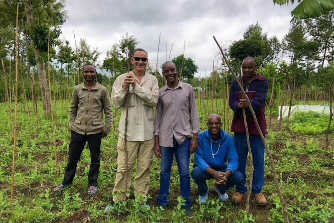  Dr. Bowman discussing pest control procedures with USAID-supported vegetable farmers in Arusha, Tanzania.