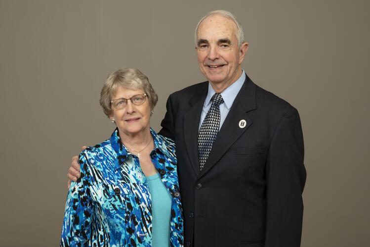 Roscoe stands with his arm around Ann Pershing in a formal photo.