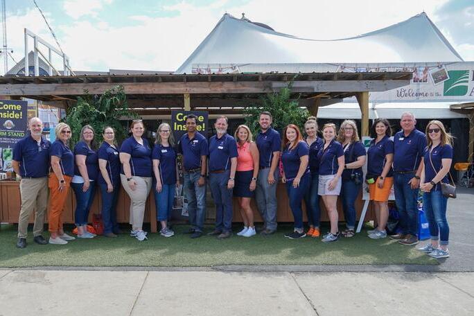Illinois 4-H, Illinois Extension and ACES staff stand together at the 2022 State Fair