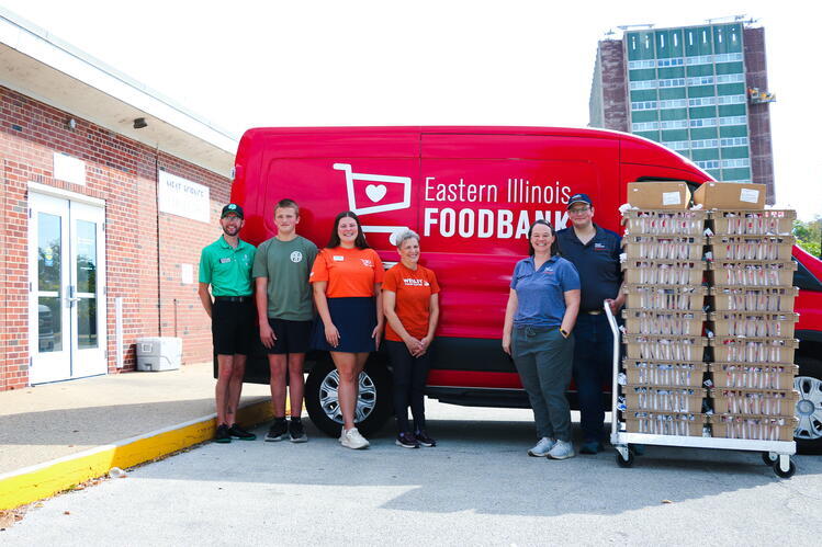 Representatives from Illinois 4-H, the Eastern Illinois Foodbank, Wesley Food Pantry, and the University of Illinois College of ACES load up hundreds of pounds of champion livestock meat for distribution during Hunger Action Month. 