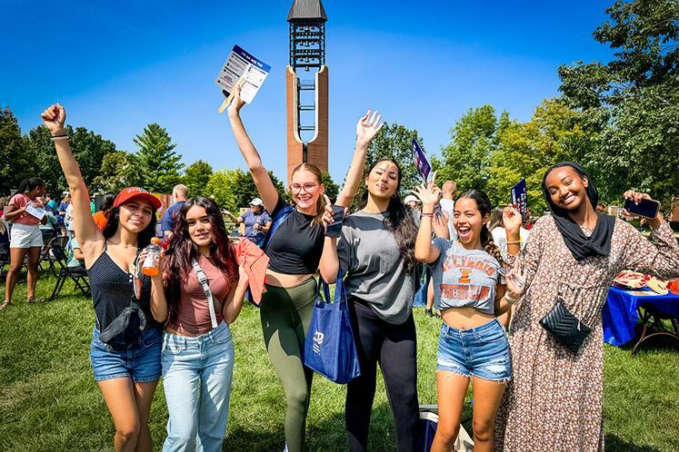 Six incoming ACES students pose in front of the McFarland Bell Tower.