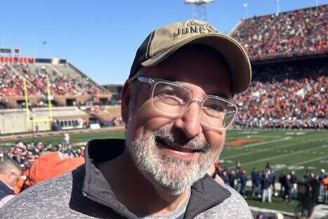 Bowman cheering on the Fighting Illini at a football game. 