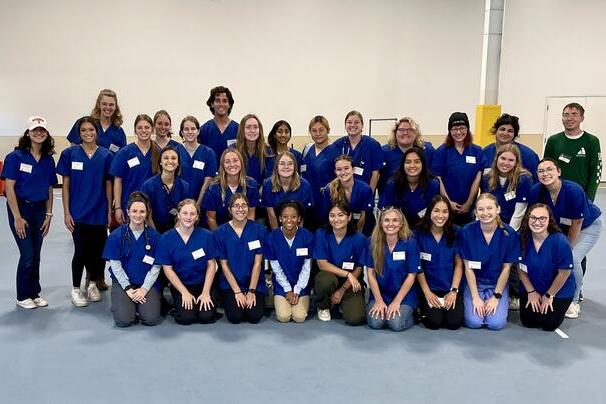Group of volunteers pose for a picture at the Champaign County Humane Society pet vaccine clinic