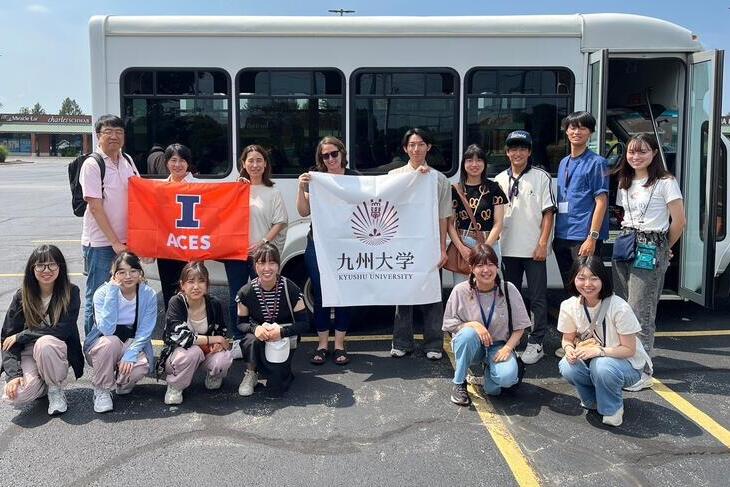 Kyushu students with ACES flag and Kyushu flag