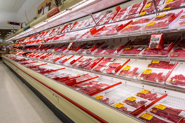 meat packages on display in grocery store counter