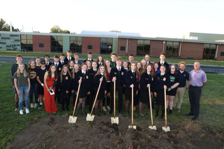 Students and teachers at Meridian High School break ground for new agriculture building and pose for photo