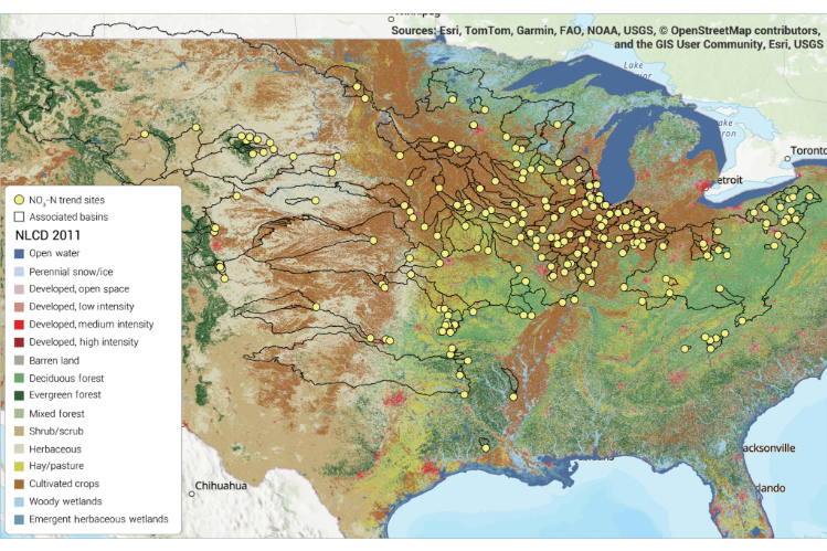 A map of the watershed areas sampled in a large water quality study in the United States. The U.S. map is color-coded based on vegetation type and shows yellow dots where water quality was sampled and water flow measured.