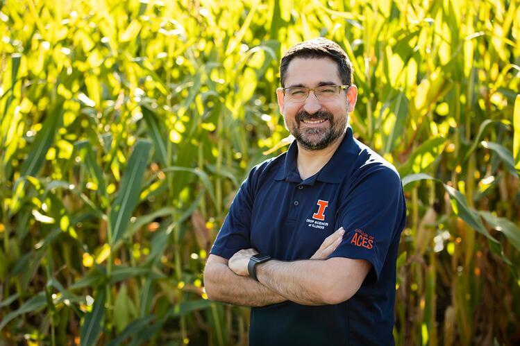 Nicolas Martin standing in front of a stand of corn