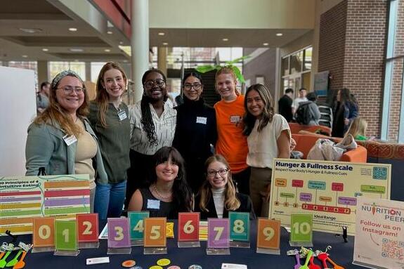 Ashley Equíhua and other nutrition peers pose for group photo