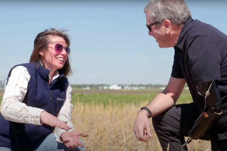 Professor Emily Heaton and PBS NewsHour Science Correspondent Miles O'Brien discuss bioenergy crops at the Energy Farm at the University of Illinois Urbana Champaign.. 
