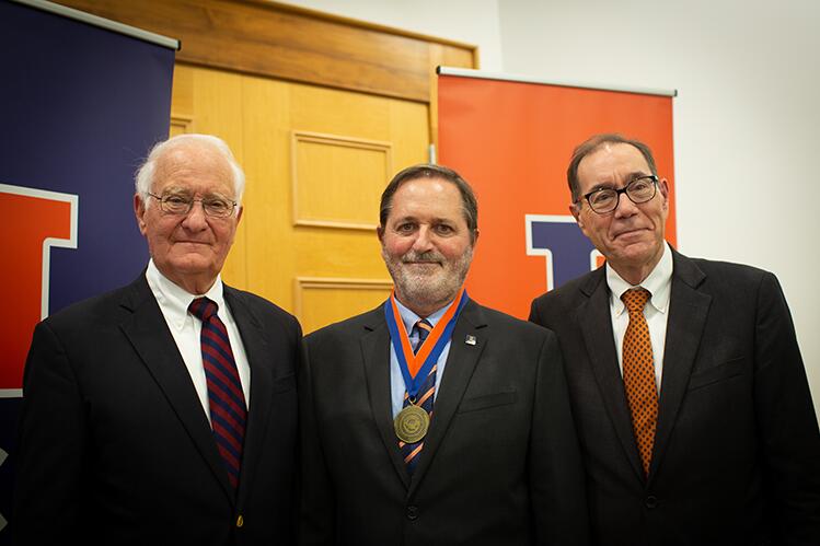 President Emeritus Robert Easter, Dean Germán Bollero, and Provost John Coleman stand together after the ceremony.