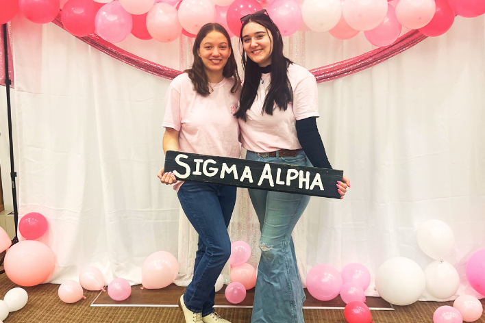 Sara Poletti stands beside a fellow Sigma Alpha Professional Agricultural Sorority member