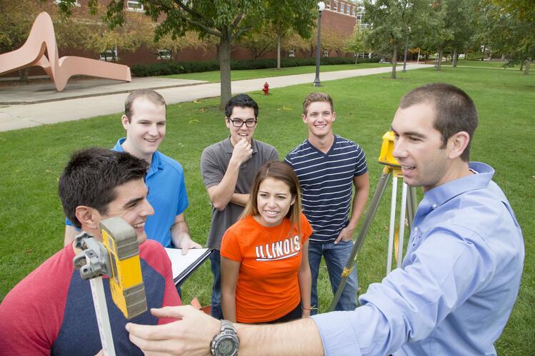 Professor interacts with students on the South Quad.