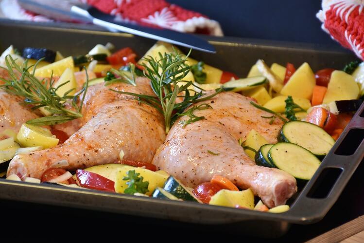 chicken and vegetables in roasting pan