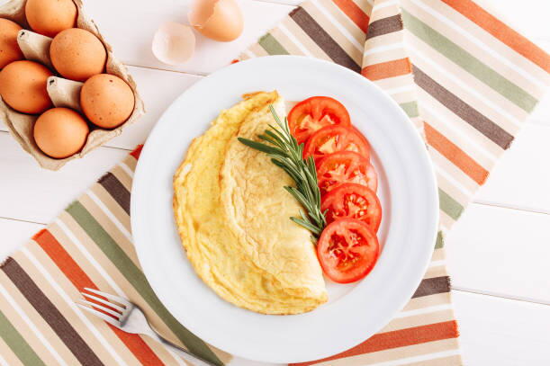 Tasty egg dish with tomato Egg and tomato on plate